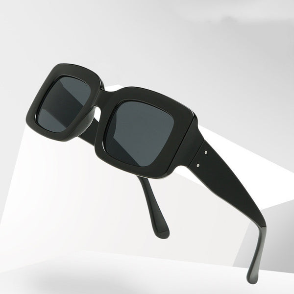 White square-frame sunglasses with dark gray lenses, featuring a chunky and fashionable design.