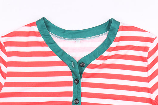 Family of six wearing matching red and white striped long-sleeved pajamas with green cuffs and festive hats. - Image 15