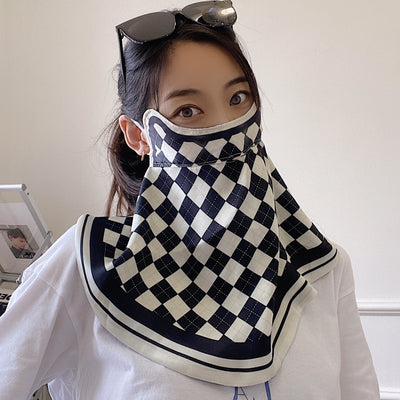 Female cream and black floral polka dot sun protection mask with ear loops, designed for eye corner protection. - Image 29