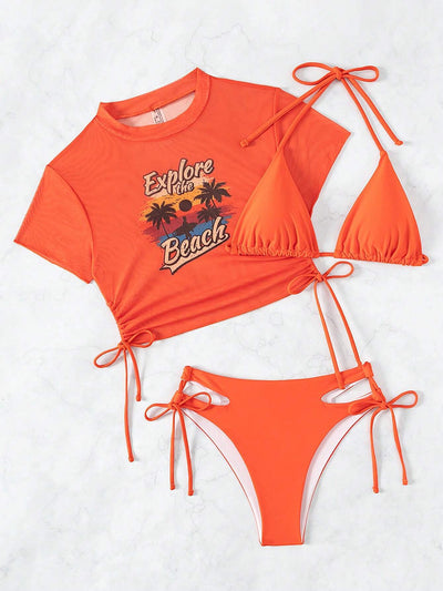 Black three-piece swimsuit with a mesh crop top featuring an "Explore the Beach" graphic, bikini top, and high-waisted bottoms. - Image 33