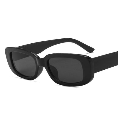 Black rectangular fashion sunglasses with dark lenses, featuring a thick frame and temples, angled on a white background. - Image 22