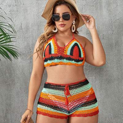 Woman in a blue and white striped crochet two-piece swimsuit with a halter top and high-waisted shorts. - Image 3
