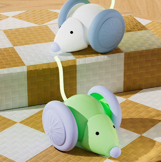 Green and purple electric mouse car cat toy with a glowing tail on a woven mat, designed for interactive play. - Image 29