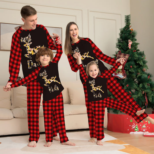 Kids' black and red buffalo plaid pajamas with a colorful deer graphic and "Kids" text on the top.