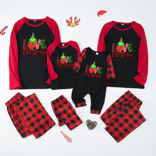 Kids' Christmas pajama set with black and red raglan top featuring a 'LOVE Christmas' graphic and plaid pants. - Image 2