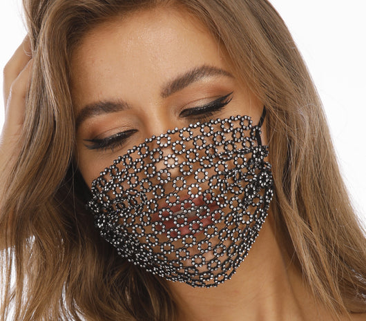 Black fishnet-shaped face mask with star pattern and clear rhinestones, worn by a woman with light brown hair. - Image 25