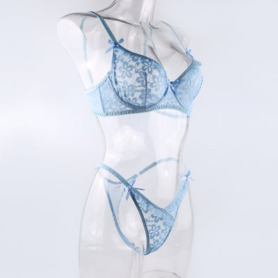 Light blue lace bralette and thong lingerie set with bow details and ruffle trim, displayed on a light surface. - Image 9