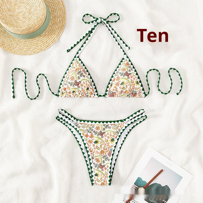 White halter bikini with green rickrack trim and a vibrant floral and bird print, featuring a triangle top and high-cut bottom. - Image 5