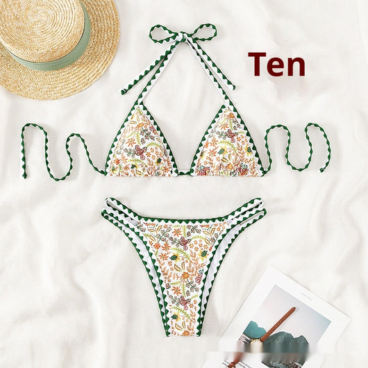 White halter bikini with green rickrack trim and a vibrant floral and bird print, featuring a triangle top and high-cut bottom. - Image 5