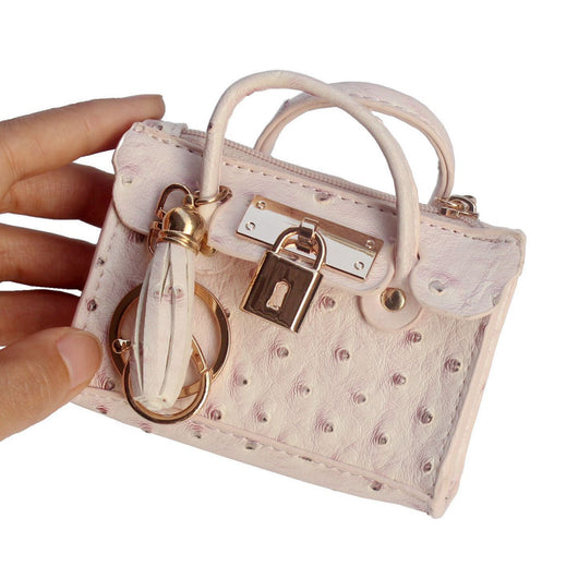 Bolso de Mano Minimalista en Cuero con Borlas - Image 15