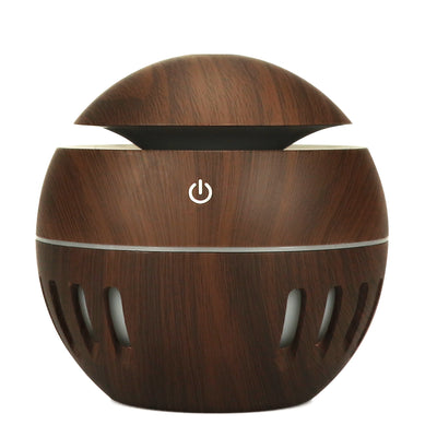 White portable home office humidifier with a spherical base, dome top, and glowing blue LED light accents. - Image 10
