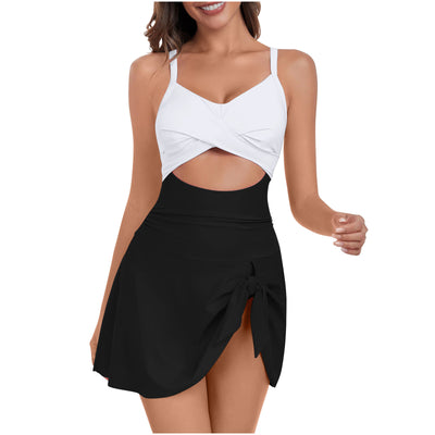 Women's black and white swimsuit dress with a criss-cross white top, midriff cutout, and a black skirted bottom with a side tie. - Image 4