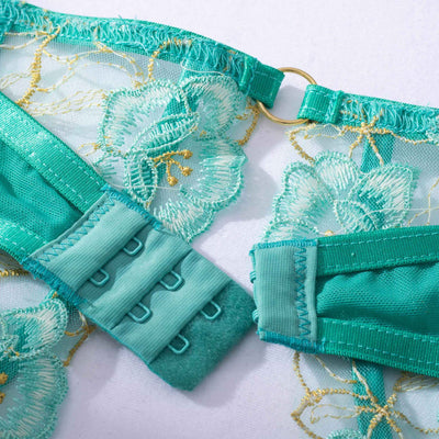 Teal women's fashion bra set with floral embroidery, including an underwire bra, thong, and garter belt. - Image 5