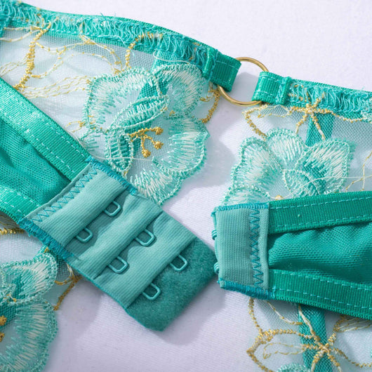 Teal women's fashion bra set with floral embroidery, including an underwire bra, thong, and garter belt. - Image 5
