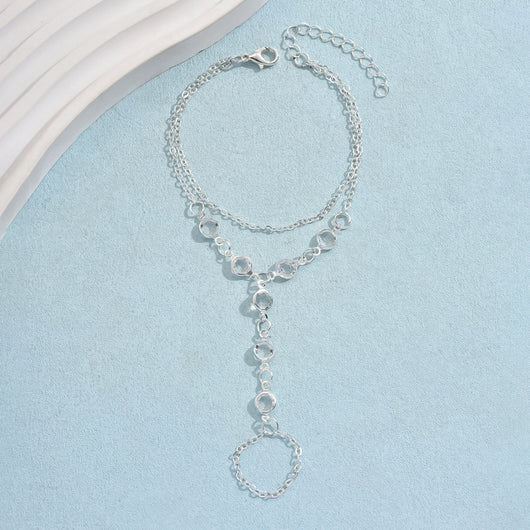 Gold-tone layered bracelet ring with clear crystal accents and a finger loop, featuring a lobster clasp closure. - Image 7