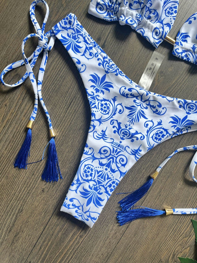 Women's blue and white porcelain print halter bikini with tie-side bottoms and blue tassels. - Image 17