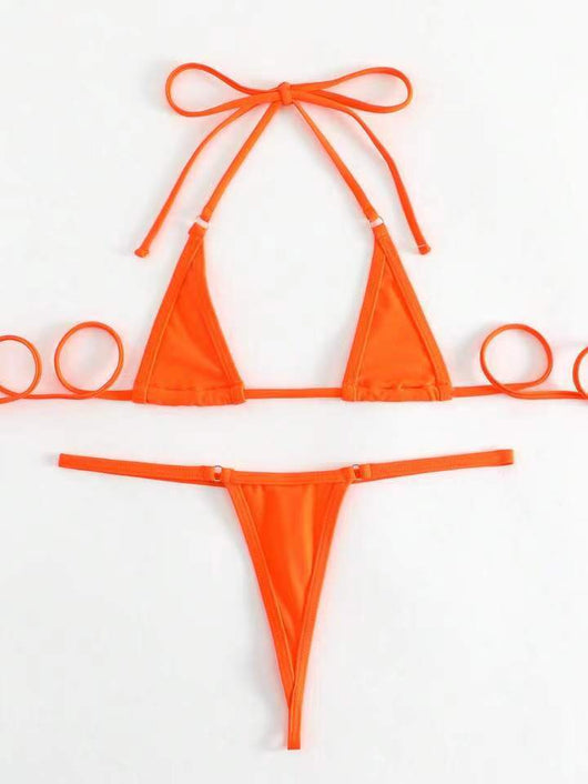 Orange solid color three-point bikini with a micro triangle top and thong bottom, modeled on a woman. - Image 26
