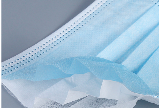 Light blue disposable face mask with ear loops, showing pleated design, against a white background. - Image 5