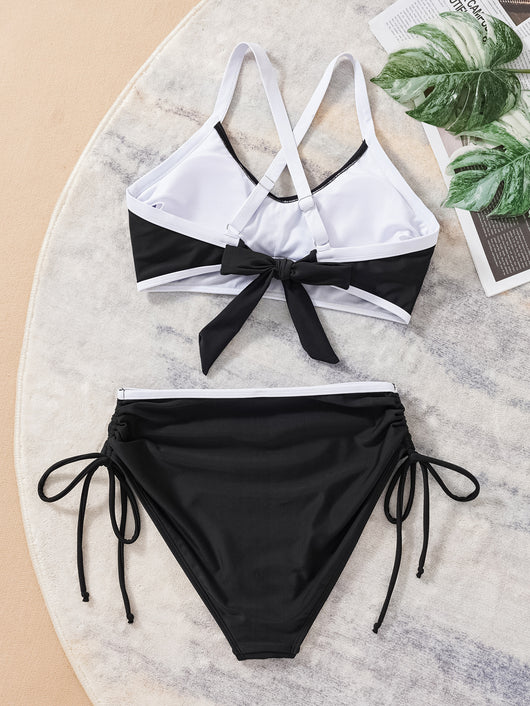Black and white color matching bikini swimsuit with a high-waisted drawstring bottom and a split top. - Image 15