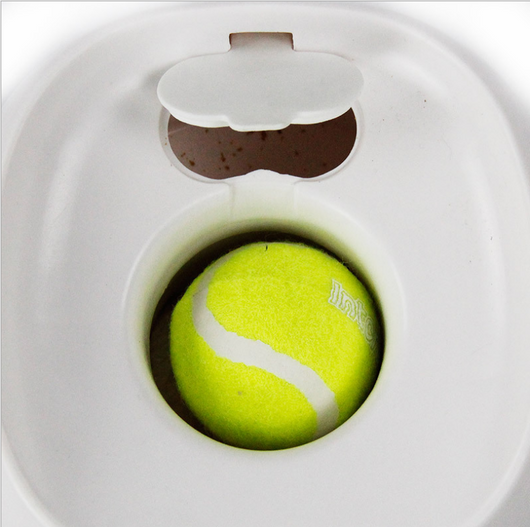 AFP Fetch'N Treat interactive dog toy, a white and green machine that dispenses treats with a tennis ball. - Image 10