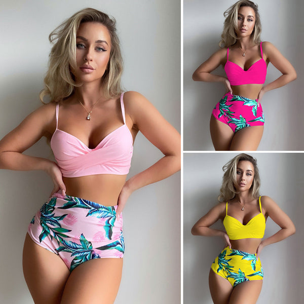 Woman wearing a bright yellow push-up bikini top and high-waisted bottoms with a green tropical leaf print.
