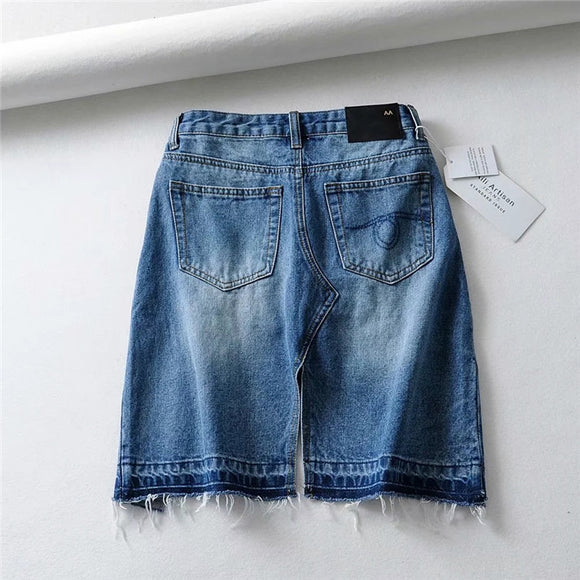 Falda Denim Irregular con Borde Crudo