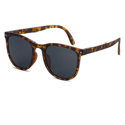 Beige oval-frame sunglasses with brown polarized lenses and foldable temples on a white background. - Image 13