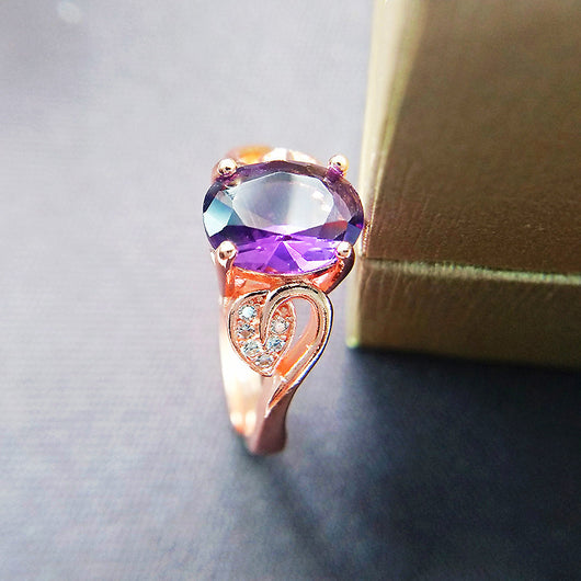 Rose gold necklace with a teardrop purple gemstone pendant and matching dangle earrings. - Image 14