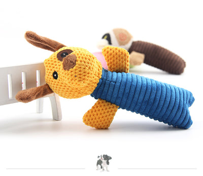 Yellow and blue plush dog toy with ribbed body, alongside a blue dog raincoat with hood and reflective strips. - Image 10