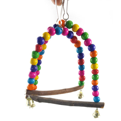 Blue and yellow macaw parrot on a colorful wooden bead swing with bells, designed for bird cages. - Image 8