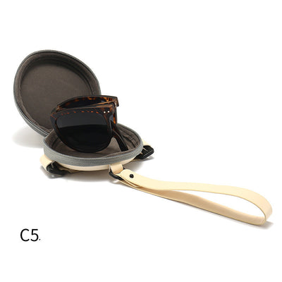 Light brown foldable women's sunglasses with round frames and brown polarized lenses on a white background. - Image 9