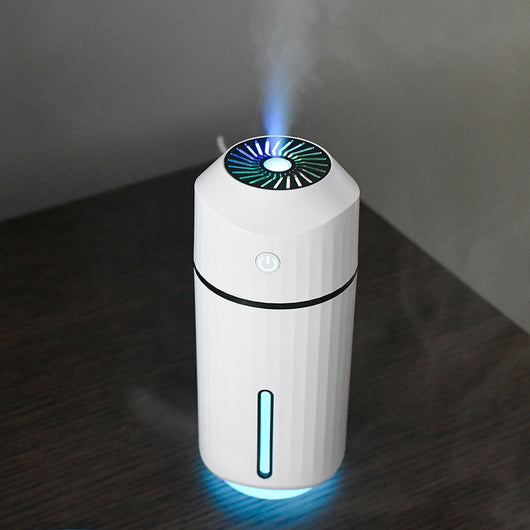 Pink columnar mini car humidifier with a power button and a clear water level indicator on a white background. - Image 12