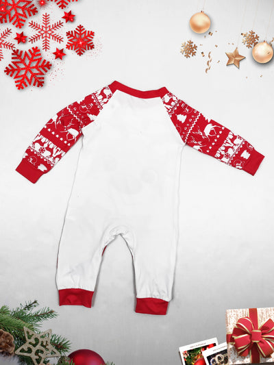 Man wearing a red and white Christmas pajama set with a reindeer graphic and fair isle pattern. - Image 2