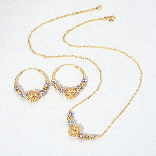 Multicolor cutout round beads necklace and matching hoop earrings set with gold, silver, and purple beads.