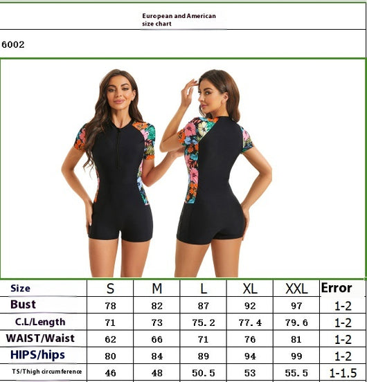 Women's black one-piece swimsuit with short sleeves and colorful floral and tropical leaf print panels. - Image 6