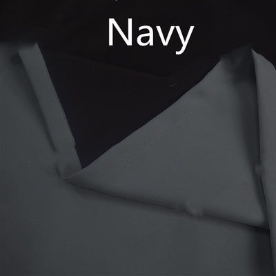 Close-up of a navy blue blackout curtain, showcasing the fabric texture and the black lining on the back. - Image 7