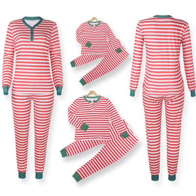 Family of four wearing matching red and white striped Christmas pajamas with green cuffs. One child wears a Santa hat, another wears reindeer antlers. - Image 14