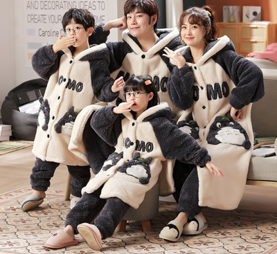 Family of four wearing matching red and cream coral velvet hooded pajamas with embroidered 'money' text and cute pockets. - Image 7