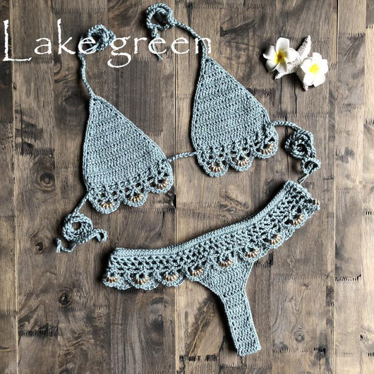 Lake green handmade crochet bikini set with gold beads, featuring a triangle top and thong bottom on wood. - Image 6