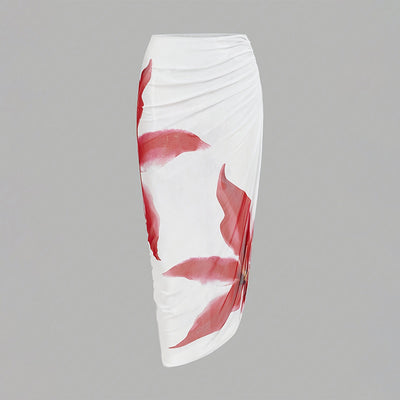 White one-piece swimsuit with red floral print and matching ruched sarong skirt for beach or resort wear. - Image 4