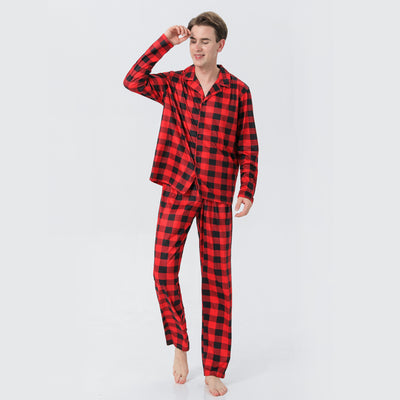 Baby in a red and black buffalo plaid long-sleeve pajama romper, viewed from the back with arms raised. - Image 4