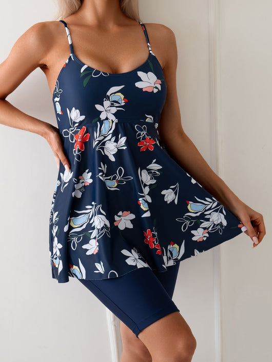 Women's navy blue two-piece swimsuit with white floral tankini top and matching solid swim shorts. - Image 18