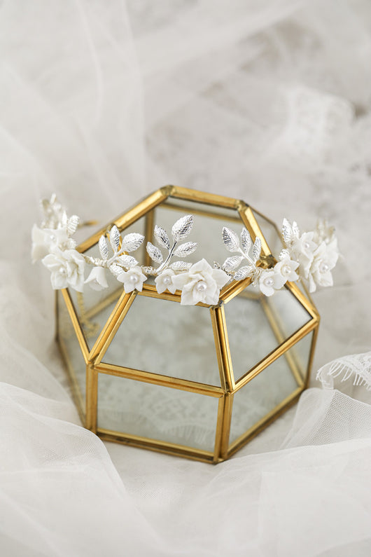 Silver-toned hair band with white ceramic flowers, faux pearls, and delicate silver leaves, perfect for bridal wear. - Image 10