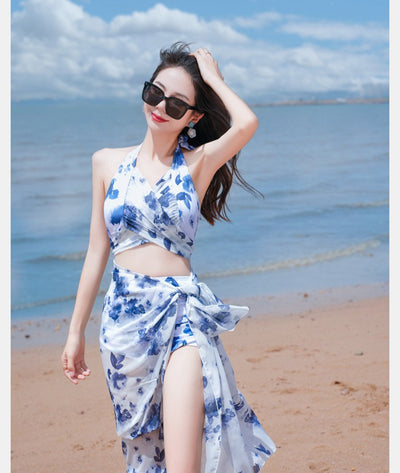 Women's light blue tropical leaf print three-piece swimsuit with short sleeve bikini top, bottoms, and sarong skirt. - Image 29