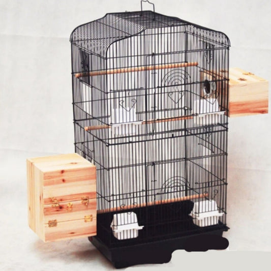White wire bird cage with arched top, multiple wooden perches, plastic food cups, and two wooden nesting boxes.