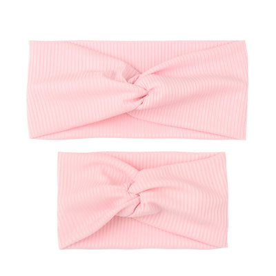Matching dusty rose ribbed knit headbands with a twisted knot, one for an adult and one for a child. - Image 7