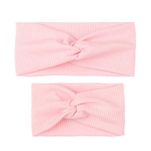 Matching dusty rose ribbed knit headbands with a twisted knot, one for an adult and one for a child. - Image 7