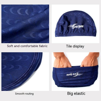 Black cloth swimming cap with a blue tribal-style graphic design on the side. - Image 15