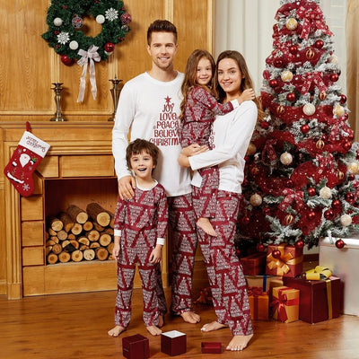 Family of four in matching Christmas pajamas: white tops with red tree graphic, red bottoms with white text. - Image 16