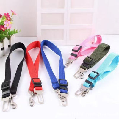 Pink adjustable dog car seat belt with a metal seatbelt buckle and a silver swivel snap hook. - Image 9